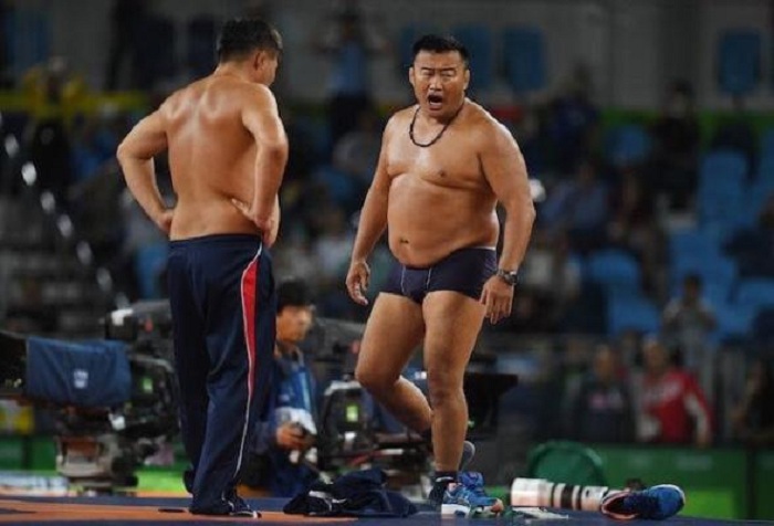Mongolian coaches take off clothes in protest of wrestling match result 